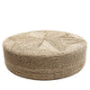 Round woven ottoman with a star pattern on a white background