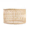 Woven rattan basket on a white background