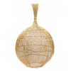 Woven spherical object made of natural fibers on a white background
