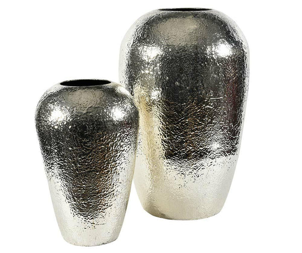 Two silver metallic vases on a white background