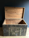 Wooden trunk with decorative elements on a dark background