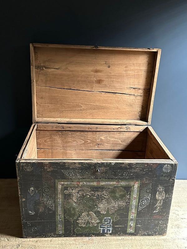 Wooden trunk with decorative elements on a dark background
