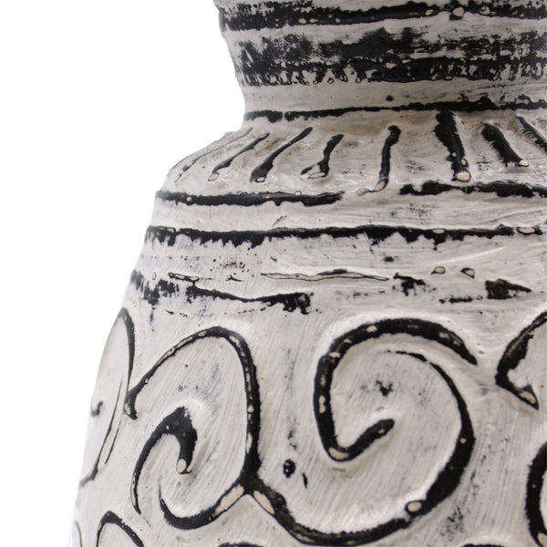 Ceramic vase with black patterns on a white background