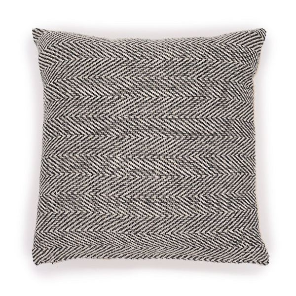 Decorative pillow with a zigzag pattern on a white background