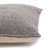 Textured pillow with a herringbone pattern on a white background
