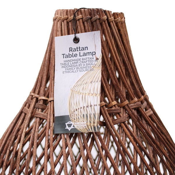 Rattan table lamp with a label on a white background