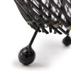 Close-up of a black metal basket with spherical ends on a white background