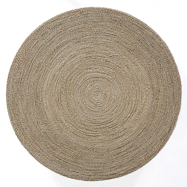 Round woven mat on a white background