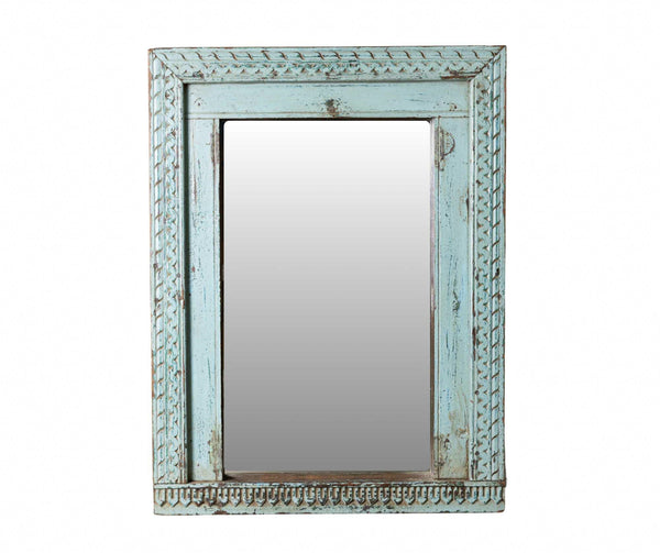 Decorative mirror with a light blue frame on a white background