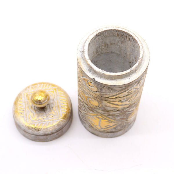 Silver and gold decorative container with lid on a white background