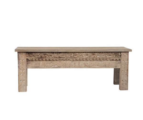 Wooden bench with intricate carvings on a white background
