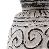 Ceramic vase with black patterns on a white background