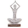Decorative statue of a person in a yoga pose with 'Hands to the Heavens Embrace Peace' text on a white background